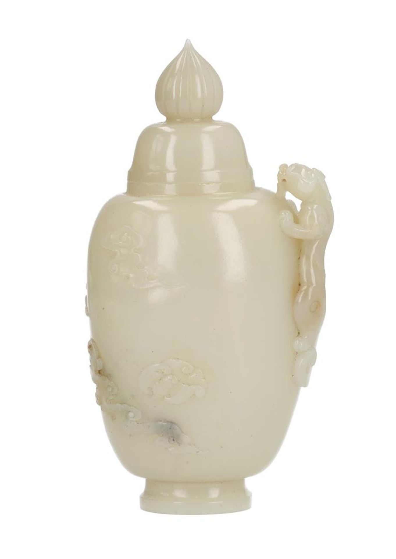 A jade lidded jar, decorated with a dragon and bats in relief. Unmarked. China, 20th century. In
