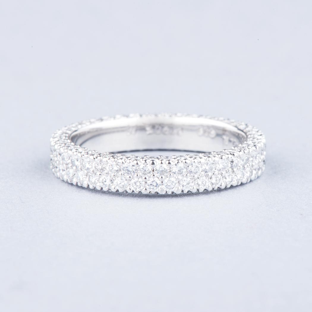 A PLATINUM DIAMOND ETERNITY RING the two centre rows and sides set with round brilliant-cut diamonds