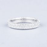 A PLATINUM DIAMOND ETERNITY RING the two centre rows and sides set with round brilliant-cut diamonds