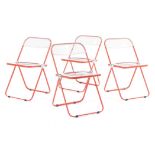A SET OF FOUR ORANGE AND CLEAR PLIA CHAIRS DESIGNED BY GIANCARLO PIRETTI FOR CASTELLI