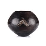 A ZULU BEERPOT the burnished ovoid body with amasumpa decoration 18cm high