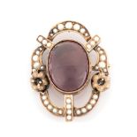 AN AMETHYST AND PEARL BROOCH the oval amethyst cabochon measuring approximately 22mm x 17mm tube-set