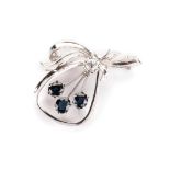 A SAPPHIRE AND DIAMOND BROOCH three oval cut blue sapphires, weighing approximately 2.21cts in total