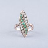 A DIAMOND AND EMERALD RING a centre row of graduating old cut emeralds ﬂanked by rows of old cut