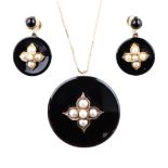 A BLACK ENAMEL AND SEED PEARL EARRING AND PENDANT SET the large round enamel discs centred by a