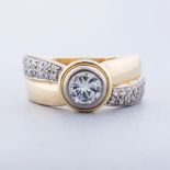 A DIAMOND RING the diamond weighing approximately 1.60ct colour F/G, clarity VVS tube-set and ﬂanked