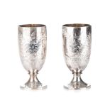 A PAIR OF VICTORIAN SILVER BEAKERS, CHARLES EDWARDS, LONDON, 1886 with foilate and scroll
