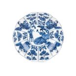 A CHINESE BLUE AND WHITE LOBED DISH, QING DYNASTY, KANGXI (1662 – 1722) centred by a seated maiden