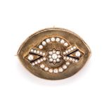 A PEARL MEMORIAL BROOCH the ﬂower and circle of half seed pearls enhanced with navy blue enamelled