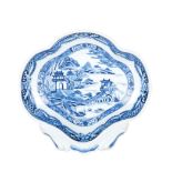 A CHINESE BLUE AND WHITE DISH, QING DYNASTY, 19TH CENTURY the lobed shell-shaped dish painted to the
