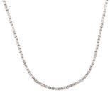 AN 18K WHITE GOLD AND DIAMOND LINE NECK PIECE a single row line neck piece of claw-set diamonds,