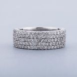 A THREE-QUARTER DIAMOND ETERNITY RING composed of ﬁve rows, embellished with round brilliant-cut