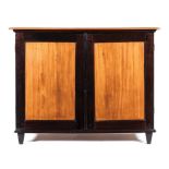 A CAPE STINKWOOD AND YELLOWWOOD LOW CUPBOARD, 19TH CENTURY the outswept cornice with canted