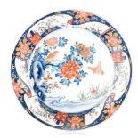 A JAPANESE IMARI PLATE, 19TH CENTURY painted with a pair of sparrows, one perched on a peony issuing