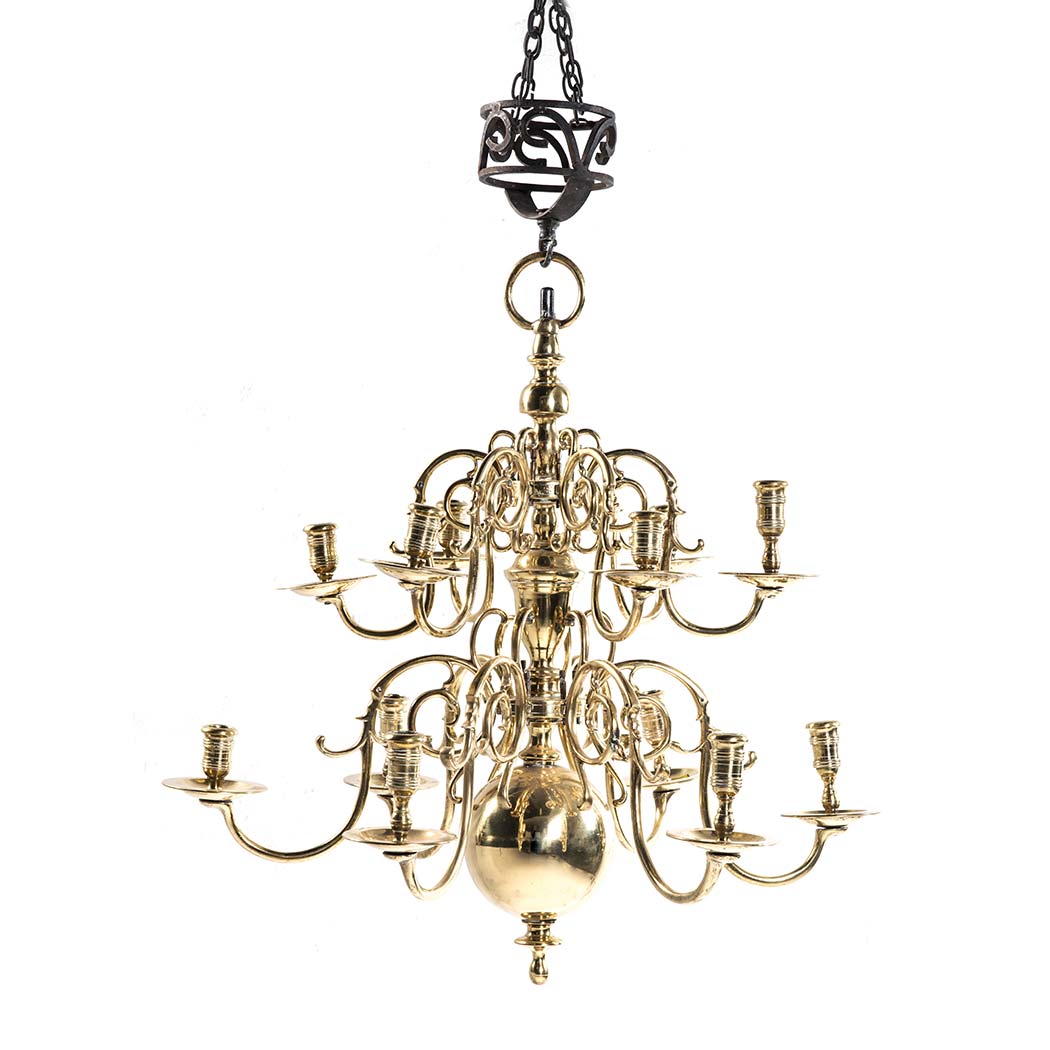 A DUTCH BRASS TWO-TIERED CHANDELIER, 18TH CENTURY the central ball and knopped column with two tiers