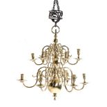 A DUTCH BRASS TWO-TIERED CHANDELIER, 18TH CENTURY the central ball and knopped column with two tiers