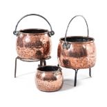 THREE COPPER CAULDRONS, 19TH CENTURY in sizes , each of globular form with rolled rim, the sides