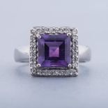 AN AMETHYST AND DIAMOND RING centred with a square step-cut amethyst weighing approximately 1.53cts,