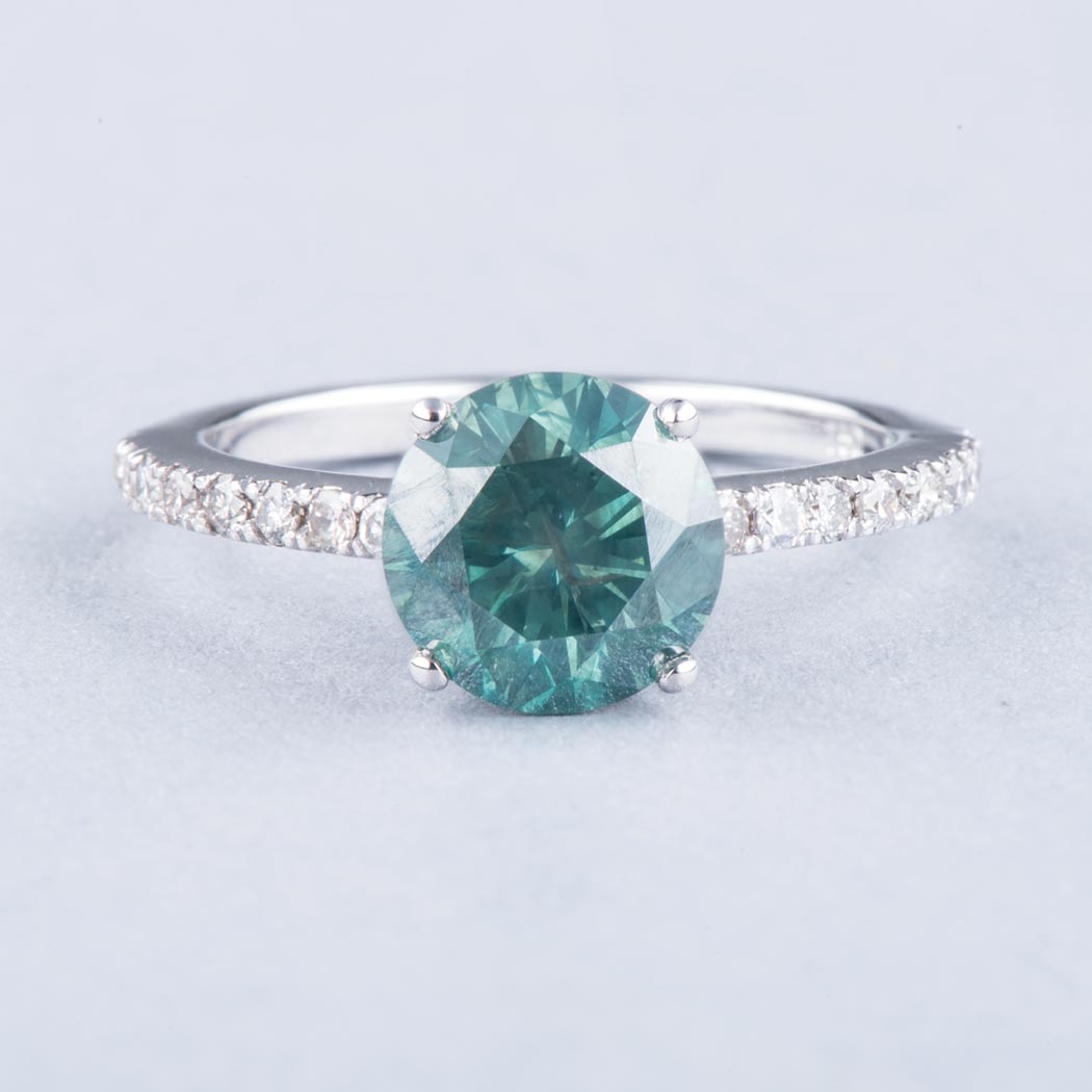 AN 18K WHITE GOLD AND GREEN DIAMOND RING the 1.70ct deep green in colour, clarity SI round