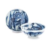 A PAIR OF CHINESE BLUE AND WHITE BOWLS each painted with a four-clawed dragon in pursuit of a