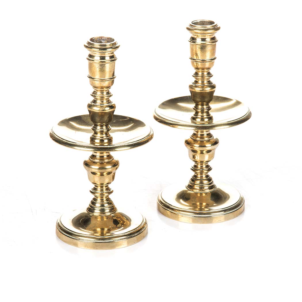 A PAIR OF BRASS HEEMSKERK, CIRCA 1780 each with broad mid-drip pan and domed foot 21cm high (2)