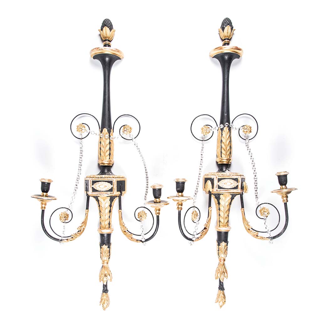 A PAIR OF TWO-LIGHT EBONISED AND GILTWOOD WALL SCONCES