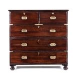 A MAHOGANY AND BRASS-MOUNTED CHEST OF DRAWERS