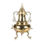 A DUTCH BRASS TRIVET SAMOVAR, 19TH CENTURY of baluster form, the sides applied with a pair of