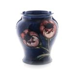A WILLIAM MOORCROFT ‘BIG POPPY’ PATTERN VASE, CIRCA 1920 the baluster form with big poppies on a
