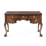 A GEORGE III WALNUT WRITING TABLE the moulded crossbanded and inlaid rectangular top above a long