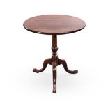 A GEORGE III OAK TRIPOD TABLE the circular top on a turned tapering column, on hipped outswept legs,