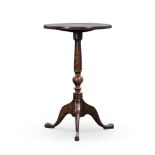 A GEORGE III MAHOGANY WINE TABLE the circular top on a turned tapering column on hipped outswept