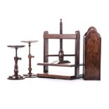 TWO WOODEN ADJUSTABLE CANDLE STANDS, EARLY 19TH CENTURY in sizes, the largest 29cm high; and A