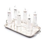 A SET OF SIX EDWARDIAN SILVER-MOUNTED GLASS NOGGINS AND TRAY, BIRMINGHAM, 1903 the rectangular