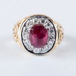 A RUBY AND DIAMOND RING the 4.11ct oval cabochon ruby is set with 14 round brilliant cut diamonds