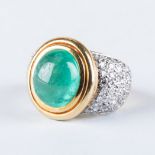 AN EMERALD AND DIAMOND DRESS RING, JENNA CLIFFORD with a cabochon emerald weighing approximately 7.