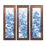 A SET OF THREE CHINESE BLUE AND WHITE PLAQUES rectangular, each depicting rockwork, mountainous