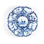 A DUTCH DELFT CHARGER, DE GRIEKSE A, CIRCA 1670 scalloped rim, painted in underglaze blue with