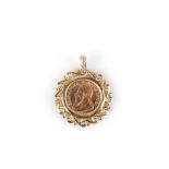 A COIN AND DIAMOND PENDANT the gold coin is mounted in a frame of scrolls and set with eleven