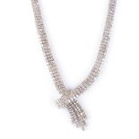 A DIAMOND NECKPECE of cross-over design, three rows of claw set round brilliant-cut diamonds