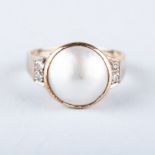 A 9K YELLOW GOLD AND DIAMOND RING the mabe pearl is set in 9k yellow gold with square shapes of pave