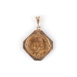 A GOLD COIN PENDANT the gold coin is set in an octagonal frame