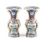 A PAIR OF CHINESE CLOISONNE VASES the bulbous body with flaring trumpet rim on cylindrical foot,