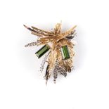 A TOURMALINE AND DIAMOND BROOCH of abstract design, highlighted with two emerald-cut green