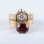 A DIAMOND AND GARNET RING the two rings, one a garnet and the other a diamond, fused to form a