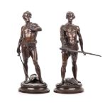 PAUL LUDWIG KOWALCZEWSKI: (1865 - 1910) A PAIR OF BRONZE SOLDIERS the one standing astride his