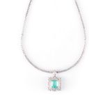 AN EMERALD AND DIAMOND NECKPIECE the claw-set square emerald-cut emerald, surrounded by two rows