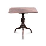 A MAHOGANY TRIPOD OCCASIONAL TABLE, 19TH CENTURY the rounded rectangular top above a ring-turned and