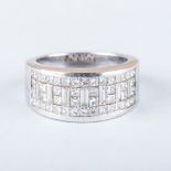 A WHITE GOLD AND DIAMOND RING pave and claw set round brilliant cut and baguette cut diamond half