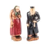 A PAIR OF CARVED AND PAINTED WOODEN FIGURES OF A RABBI AND HIS WIFE, POLAND, CIRCA 1850 made out